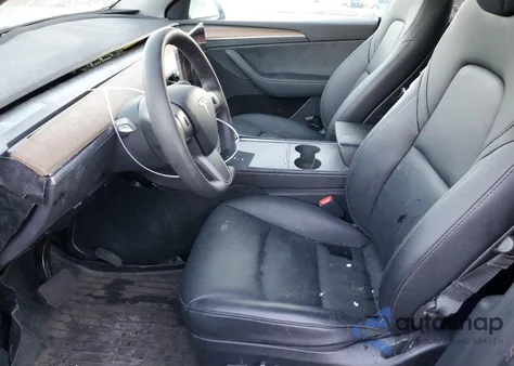 2023 Tesla Model Y из США, поврежденный, VIN 7SAYGDEE4PF899390